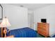Bright bedroom featuring twin beds, natural light, and wood furnishings at 202 Aylesbury Ln, Davenport, FL 33837