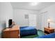 Bedroom with twin beds, natural light, and wood furnishings at 202 Aylesbury Ln, Davenport, FL 33837