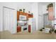 Bright kitchen featuring wood cabinets, white appliances and double door pantry at 202 Aylesbury Ln, Davenport, FL 33837