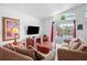 Cozy living room with plush seating and sliders leading to the pool at 202 Aylesbury Ln, Davenport, FL 33837