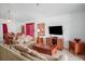 Comfortable living room with plenty of seating and an entertainment center at 202 Aylesbury Ln, Davenport, FL 33837