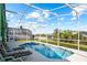 Beautiful screened-in pool area with comfortable lounge chairs, offering a private oasis for relaxation and enjoyment at 202 Aylesbury Ln, Davenport, FL 33837