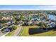 Overhead photograph of homes near a pond in the community at 209 Silas Phelps W Ct, Orlando, FL 32828