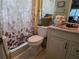 Well-maintained bathroom featuring vanity, toilet, and neutral décor at 209 Silas Phelps W Ct, Orlando, FL 32828