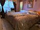 Spacious primary bedroom with plush bedding and natural light at 209 Silas Phelps W Ct, Orlando, FL 32828