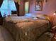 Spacious primary bedroom with plush bedding and natural light at 209 Silas Phelps W Ct, Orlando, FL 32828