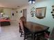 Dining Room with table, tiled floor, view of the foyer and living room area and decorations at 209 Silas Phelps W Ct, Orlando, FL 32828