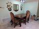 Dining Room with wooden table, tiled floor, radiator, and wall decorations and mirror at 209 Silas Phelps W Ct, Orlando, FL 32828