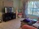Bright living room with large window and neutral wall color at 209 Silas Phelps W Ct, Orlando, FL 32828