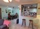 The living room opens to the dining area and has bar access to kitchen at 209 Silas Phelps W Ct, Orlando, FL 32828