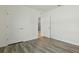 Bedroom with wood-look floors, neutral baseboards, and natural light at 3348 Perennial Ln, Kissimmee, FL 34746