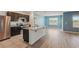 Modern kitchen with granite countertops, stainless steel appliances, and an island at 3348 Perennial Ln, Kissimmee, FL 34746