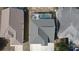 Aerial view of a well-maintained home featuring a backyard screened-in pool area at 339 Sigmund Loop, Davenport, FL 33837