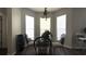Bright breakfast nook features a round glass table set and shuttered windows at 339 Sigmund Loop, Davenport, FL 33837