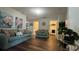 Inviting living room featuring hardwood floors and access to the laundry room for added convenience at 339 Sigmund Loop, Davenport, FL 33837