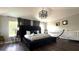 Spacious main bedroom features a king bed, hammock, crib and large windows at 339 Sigmund Loop, Davenport, FL 33837