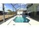 Inviting screened-in pool featuring clear blue water and a spacious deck area, perfect for relaxing and entertaining at 339 Sigmund Loop, Davenport, FL 33837