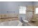 Bathroom with tile surround soaking tub and walk-in shower at 4353 Steed Ter, Winter Park, FL 32792