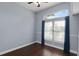 Bedroom with a large window and dark wood flooring at 4353 Steed Ter, Winter Park, FL 32792