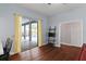 Bright dining area with hardwood floors and sliding glass doors to outdoor pool area at 4353 Steed Ter, Winter Park, FL 32792
