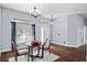 Bright dining area with a modern chandelier and hardwood floors at 4353 Steed Ter, Winter Park, FL 32792