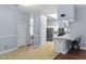 Open concept kitchen with eat-in bar, stainless appliances, and tile floors at 4353 Steed Ter, Winter Park, FL 32792