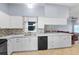 Bright kitchen with white cabinets, countertops, and a stylish backsplash at 4353 Steed Ter, Winter Park, FL 32792