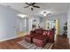 Spacious living room with wood floors and access to the screened-in patio at 4353 Steed Ter, Winter Park, FL 32792