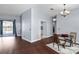 Open-concept living room with hardwood floors and sliding glass doors to the pool at 4353 Steed Ter, Winter Park, FL 32792