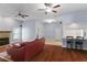Inviting living room featuring hardwood floors, fireplace and bar-top counter with seating at 4353 Steed Ter, Winter Park, FL 32792