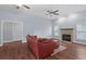 Cozy living room with fireplace, hardwood floors, and natural light at 4353 Steed Ter, Winter Park, FL 32792