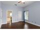 Main bedroom featuring hardwood floors and en-suite bathroom at 4353 Steed Ter, Winter Park, FL 32792