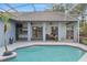 Enjoy this screened-in pool with convenient walk-in steps, offering seamless access to a covered outdoor living space at 4353 Steed Ter, Winter Park, FL 32792