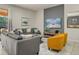 Bright living room with comfortable seating, modern decor, and large sliding glass doors at 8828 Bengal Ct, Kissimmee, FL 34747