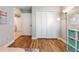 Bedroom features wood floors, closet, and motivational décor at 1052 Dees Dr, Oviedo, FL 32765