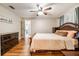 Spacious bedroom with wood floors, comfortable bed, and wood furniture, creating a cozy and inviting atmosphere at 1052 Dees Dr, Oviedo, FL 32765