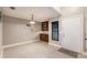 Bright dining area featuring tile floors, a decorative light fixture and a built-in buffet with storage at 1052 Dees Dr, Oviedo, FL 32765