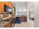 Stylish kitchen featuring granite countertops, stainless steel appliances, and ample storage space at 1052 Dees Dr, Oviedo, FL 32765