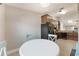 Eat-in kitchen with black appliances and light blue chairs at 1052 Dees Dr, Oviedo, FL 32765