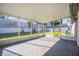 Screened lanai with brick floors and view of the backyard at 1052 Dees Dr, Oviedo, FL 32765