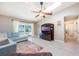 Bright living room with tile floors, a comfortable sectional sofa, and a sliding door to the lanai at 1052 Dees Dr, Oviedo, FL 32765