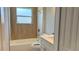 This bathroom has a shower-tub combination, stylish tile, and a sleek vanity at 13329 Sw 48Th Ave, Ocala, FL 34473