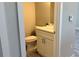 Toilet room featuring a toilet, vanity with quartz countertop, and cabinet storage at 13329 Sw 48Th Ave, Ocala, FL 34473