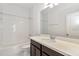 Clean bathroom featuring a single sink vanity with a large mirror and a shower-tub combo at 14154 Shocklach Dr, Winter Garden, FL 34787