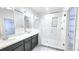 Modern bathroom with double sink vanity, glass shower enclosure, and tiled walls at 14154 Shocklach Dr, Winter Garden, FL 34787