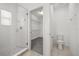 Bright bathroom features a glass-enclosed shower, toilet, and open closet space at 14154 Shocklach Dr, Winter Garden, FL 34787