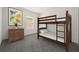 Charming bedroom with bunk beds, a window letting in natural light, and a three-drawer dresser at 14154 Shocklach Dr, Winter Garden, FL 34787