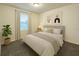 Cozy bedroom with modern décor, a comfortable bed, and soft lighting, creating a relaxing atmosphere at 14154 Shocklach Dr, Winter Garden, FL 34787