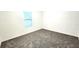 Minimalist bedroom featuring neutral carpet and a single window allowing natural light in at 14154 Shocklach Dr, Winter Garden, FL 34787