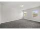 Empty bedroom features neutral paint, two windows, and carpeting at 14154 Shocklach Dr, Winter Garden, FL 34787